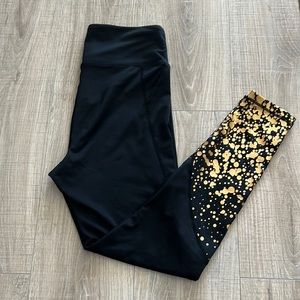 OrangeTheory black and gold workout leggings, size M